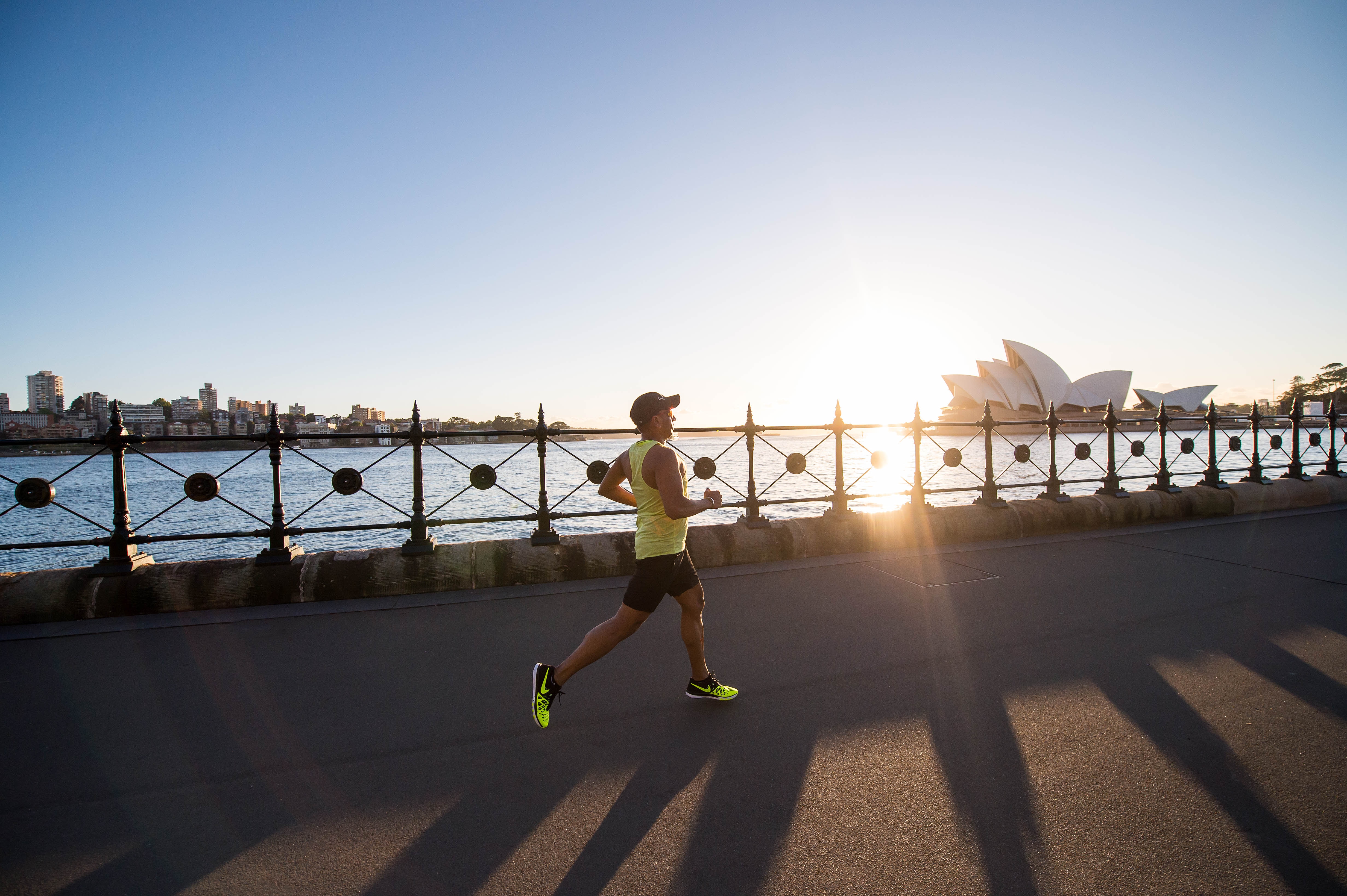 A man is running on a bridge